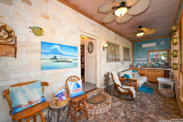 dining room featuring ceiling fan and brick wall