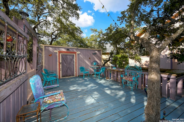 wooden terrace with a shed