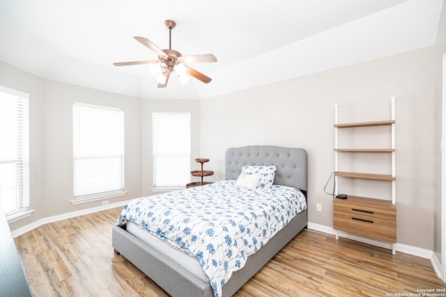 bedroom with ceiling fan and hardwood / wood-style floors