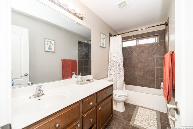 full bathroom with shower / bath combo, tile patterned floors, vanity, and toilet