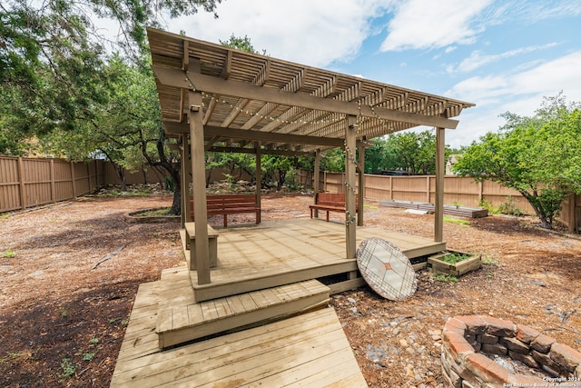 view of patio featuring a pergola and a deck