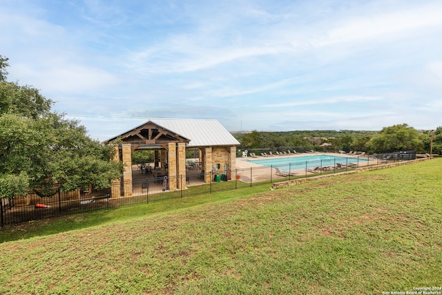 view of yard featuring a community pool