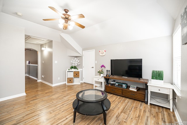 living room with light wood-type flooring, ceiling fan, and lofted ceiling