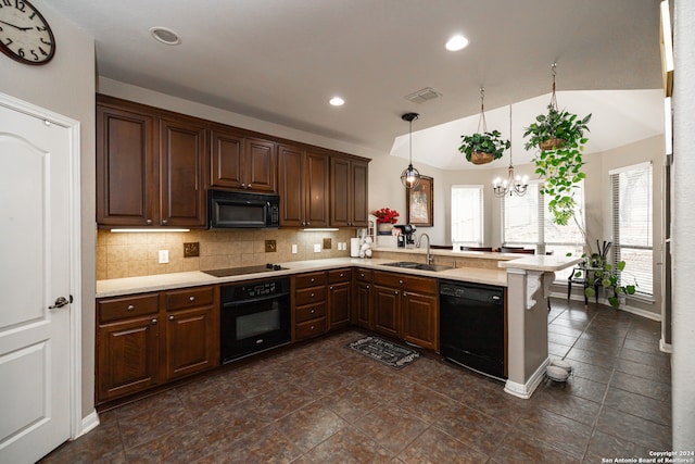 kitchen with sink, decorative backsplash, kitchen peninsula, hanging light fixtures, and black appliances