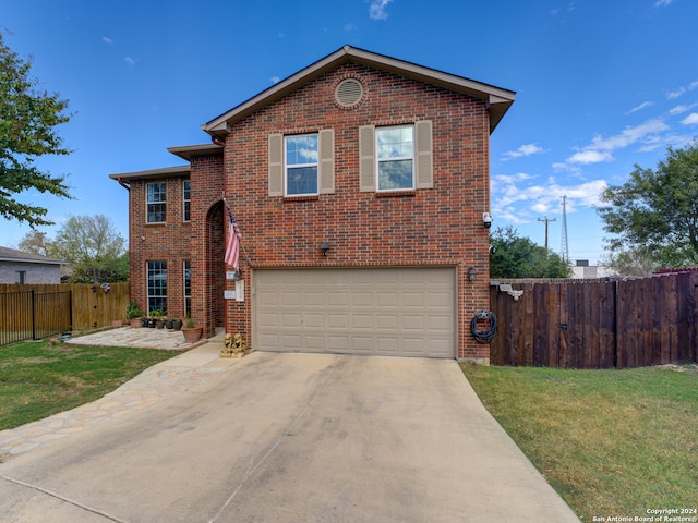 front facade with a front lawn and a garage