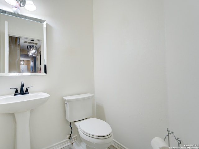 bathroom with toilet and sink