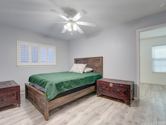 bedroom featuring light hardwood / wood-style floors and ceiling fan