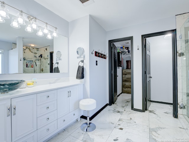 bathroom with an enclosed shower and vanity