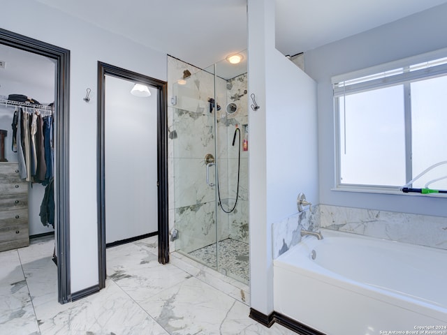 bathroom with shower with separate bathtub