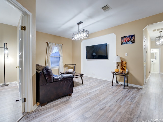 living room with light hardwood / wood-style flooring