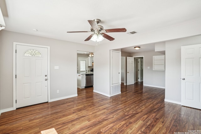 unfurnished living room with ceiling fan and dark hardwood / wood-style flooring