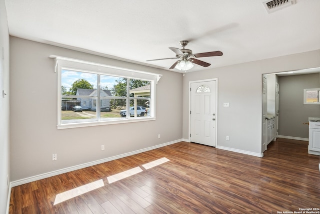 interior space featuring dark hardwood / wood-style flooring and ceiling fan