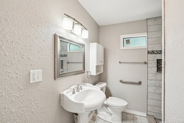 bathroom with sink and toilet