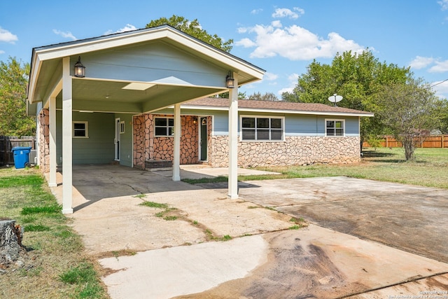 view of front of home featuring a carport