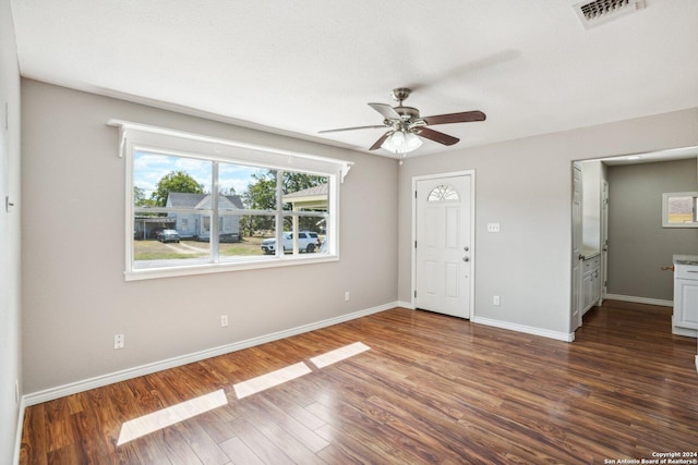 1505 B St, Floresville, TX 78114 - foyer entrance featuring a ceiling fan, baseboards, and dark wood-type flooring