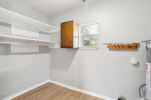 spacious closet featuring hardwood / wood-style flooring