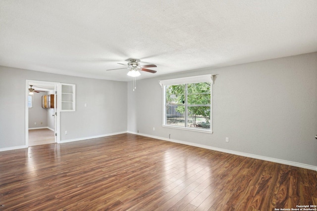 1505 B St, Floresville, TX 78114 - unfurnished room featuring a ceiling fan, wood finished floors, baseboards, and a textured ceiling