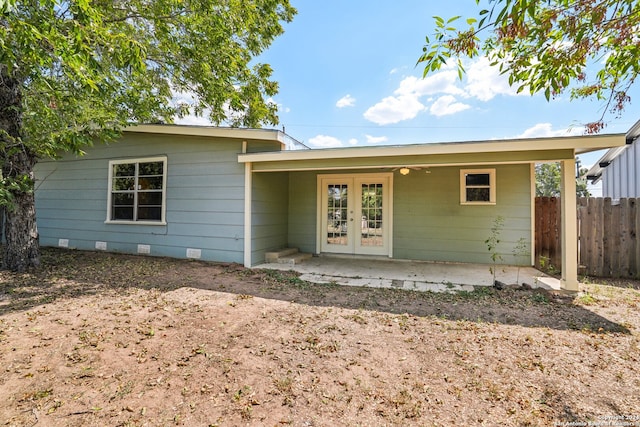 rear view of house featuring a patio area and french doors