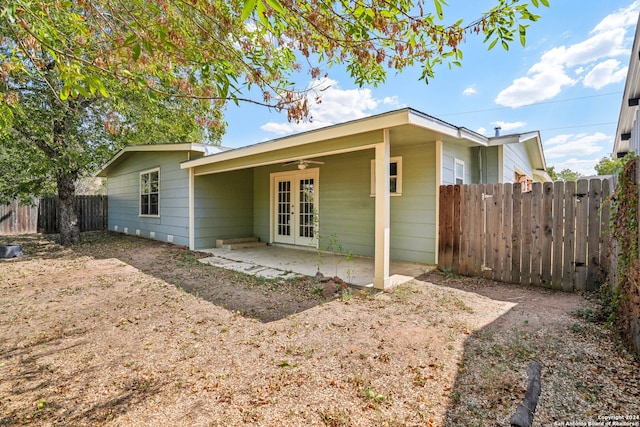 rear view of house with a patio area, french doors, and ceiling fan