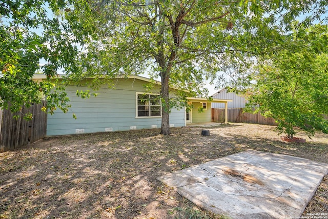 back of house featuring a patio area