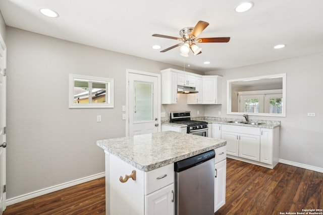 kitchen featuring sink, white cabinetry, dark hardwood / wood-style floors, a kitchen island, and stainless steel appliances