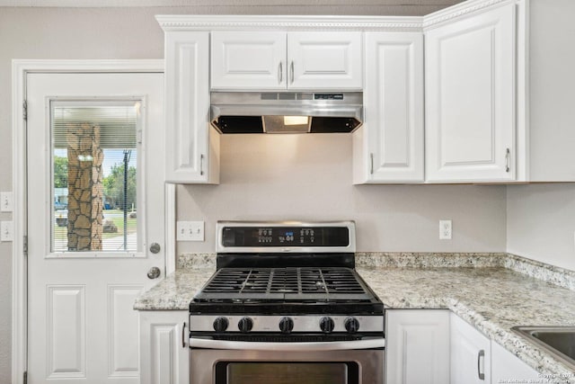 1505 B St, Floresville, TX 78114 - kitchen featuring gas stove, under cabinet range hood, white cabinetry, and light stone counters