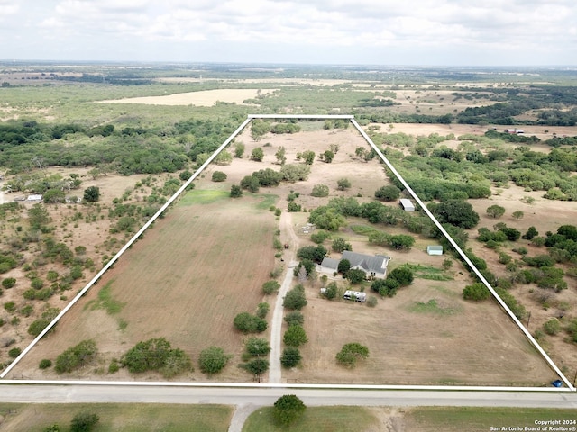 birds eye view of property with a rural view