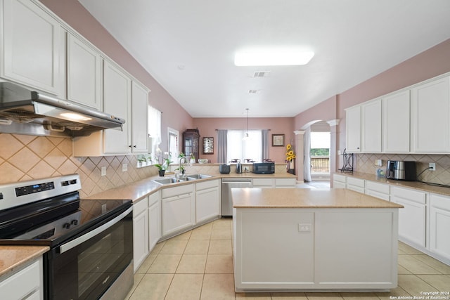 kitchen featuring pendant lighting, sink, white cabinetry, kitchen peninsula, and appliances with stainless steel finishes