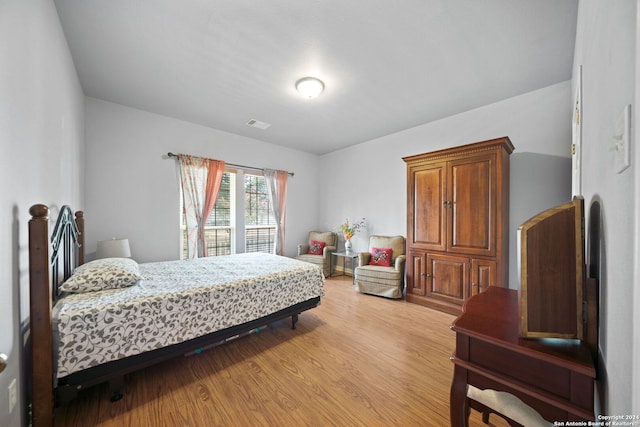 bedroom with light wood-type flooring