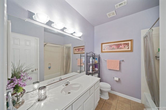 full bathroom with vanity, toilet, shower / bath combo with shower curtain, and tile patterned floors