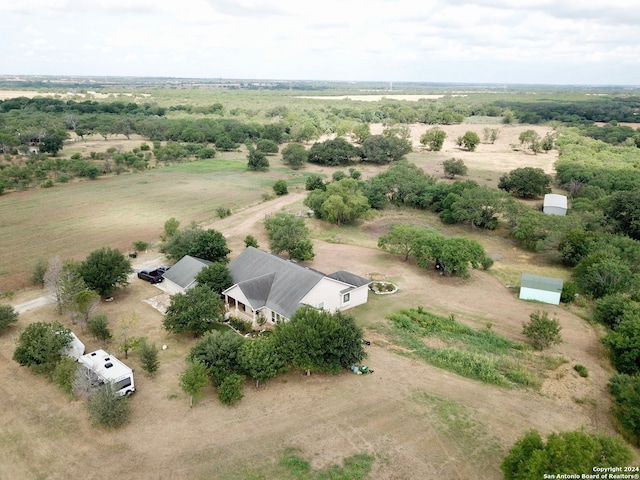 birds eye view of property featuring a rural view