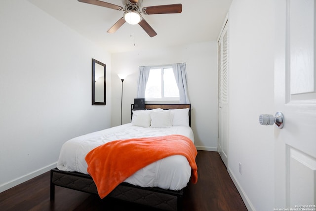 bedroom featuring ceiling fan, a closet, and dark hardwood / wood-style floors