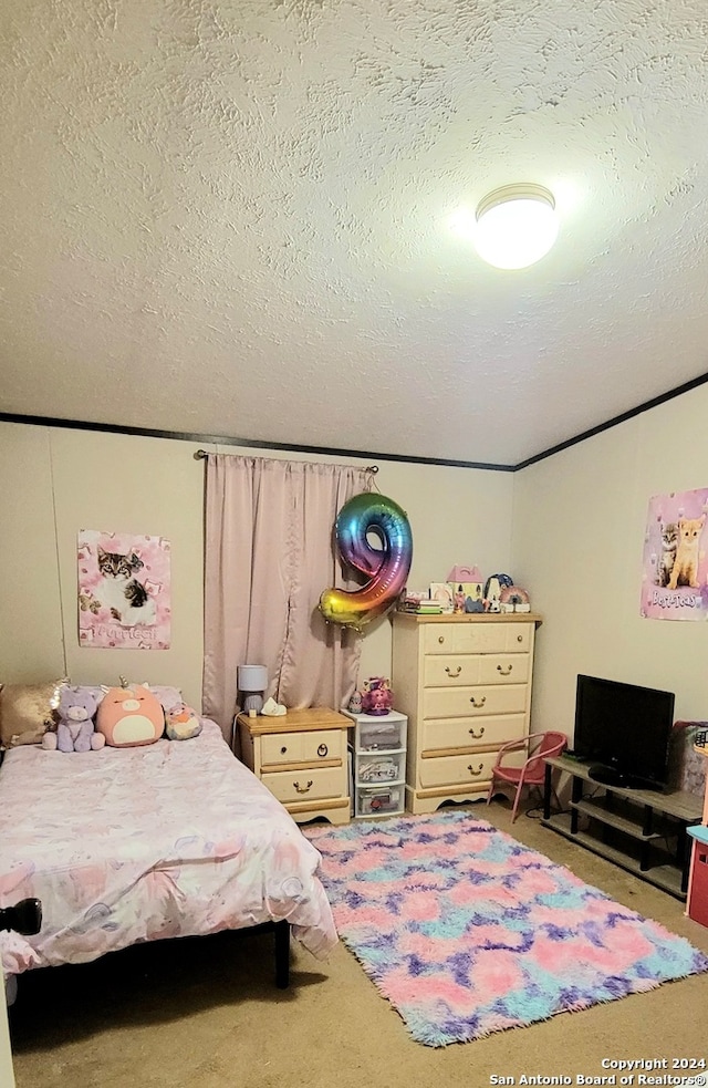 carpeted bedroom with a textured ceiling