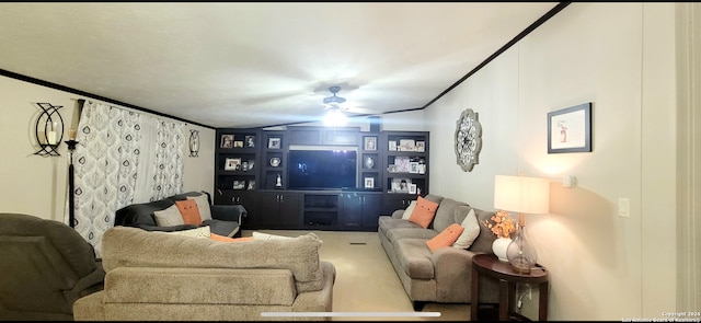 living room with ceiling fan and crown molding