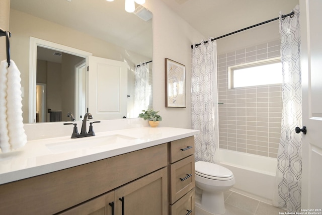 full bathroom with vanity, shower / tub combo, tile patterned floors, and toilet