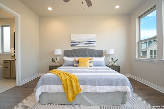 bedroom featuring ensuite bathroom, dark hardwood / wood-style floors, and ceiling fan