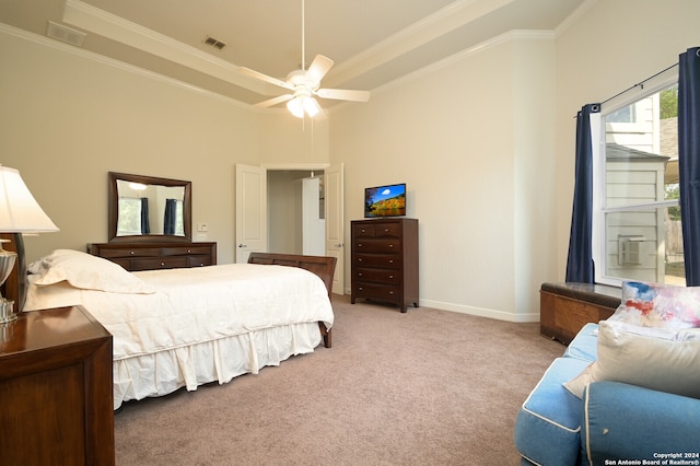 bedroom featuring ceiling fan, light colored carpet, and crown molding