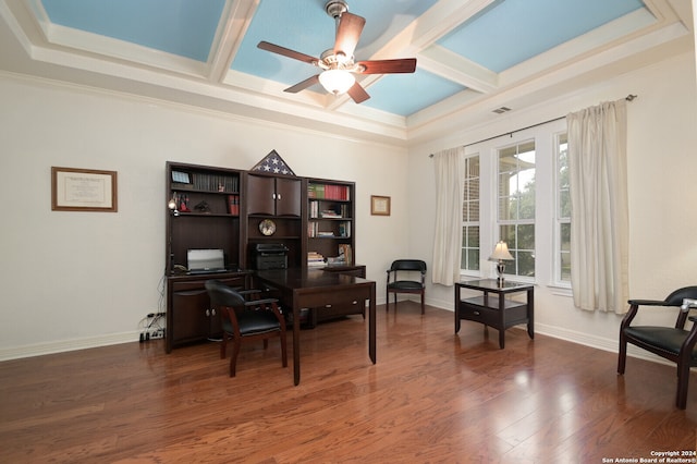 office featuring ceiling fan, coffered ceiling, dark wood-type flooring, and crown molding