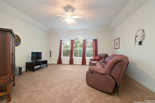 carpeted living room featuring ceiling fan