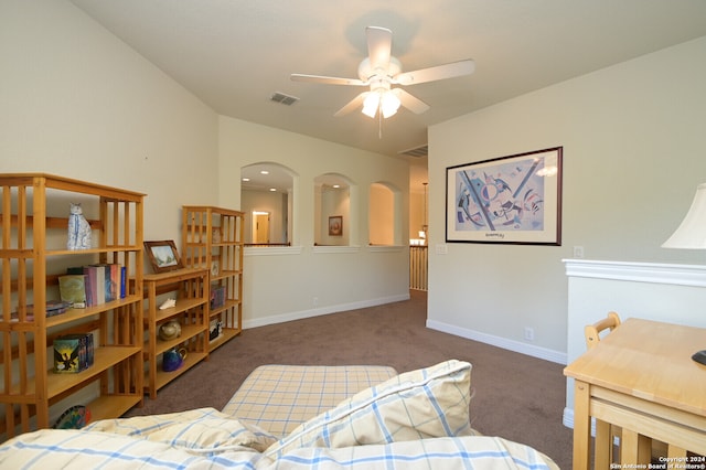 bedroom featuring dark colored carpet and ceiling fan