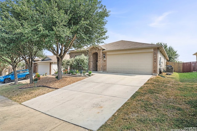 single story home featuring a front yard and a garage