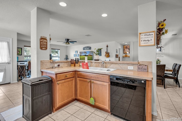 kitchen with dishwasher, ceiling fan, light tile patterned floors, and sink