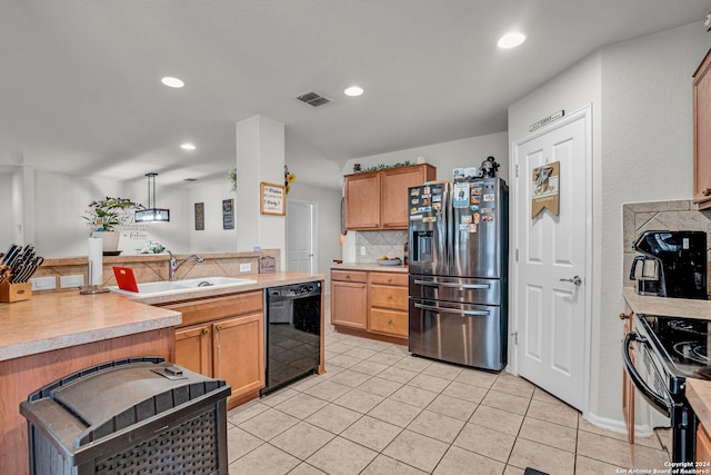 kitchen featuring black appliances, light tile patterned flooring, hanging light fixtures, and tasteful backsplash