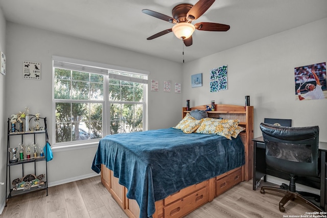 bedroom with ceiling fan and light wood-type flooring