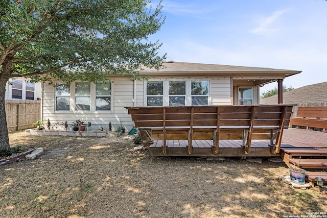 back of property with a wooden deck