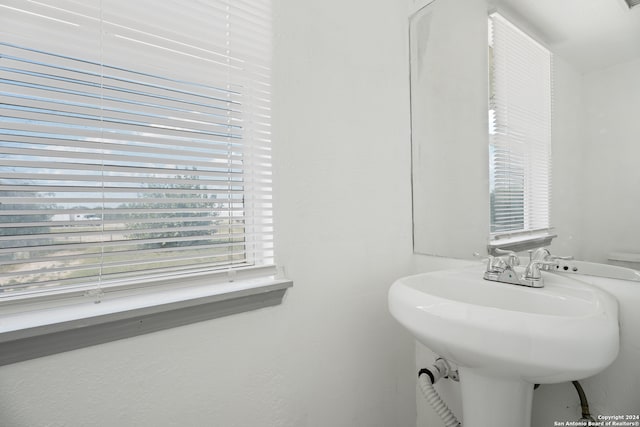 bathroom featuring sink and toilet