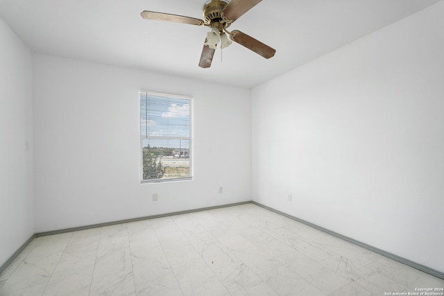 unfurnished room with ceiling fan