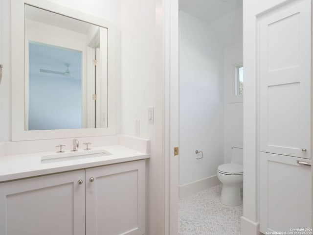 bathroom featuring vanity, toilet, and tile patterned floors