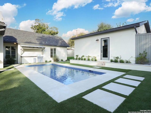 view of pool featuring a patio and a lawn