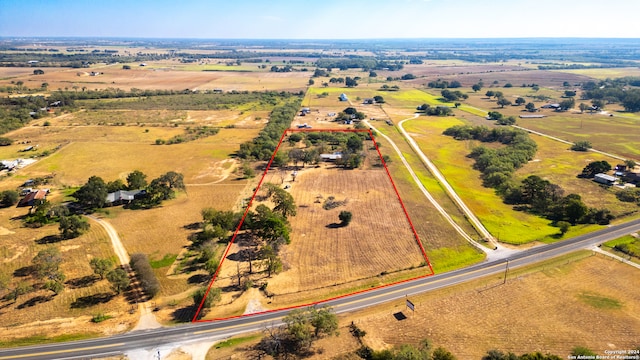 birds eye view of property with a rural view